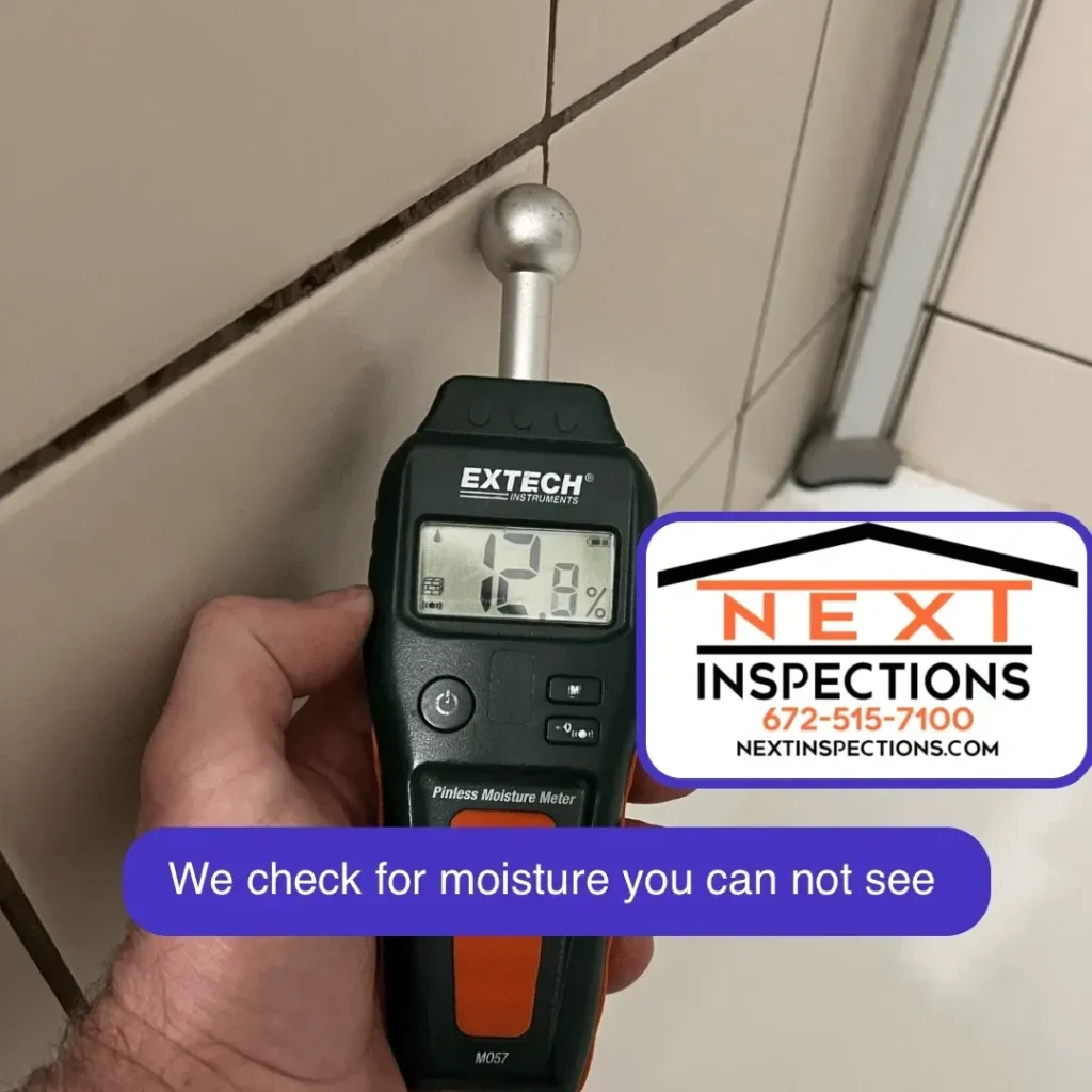 Moisture Meter being used by a home inspector in the shower